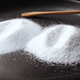 Different types of salt on a black plate